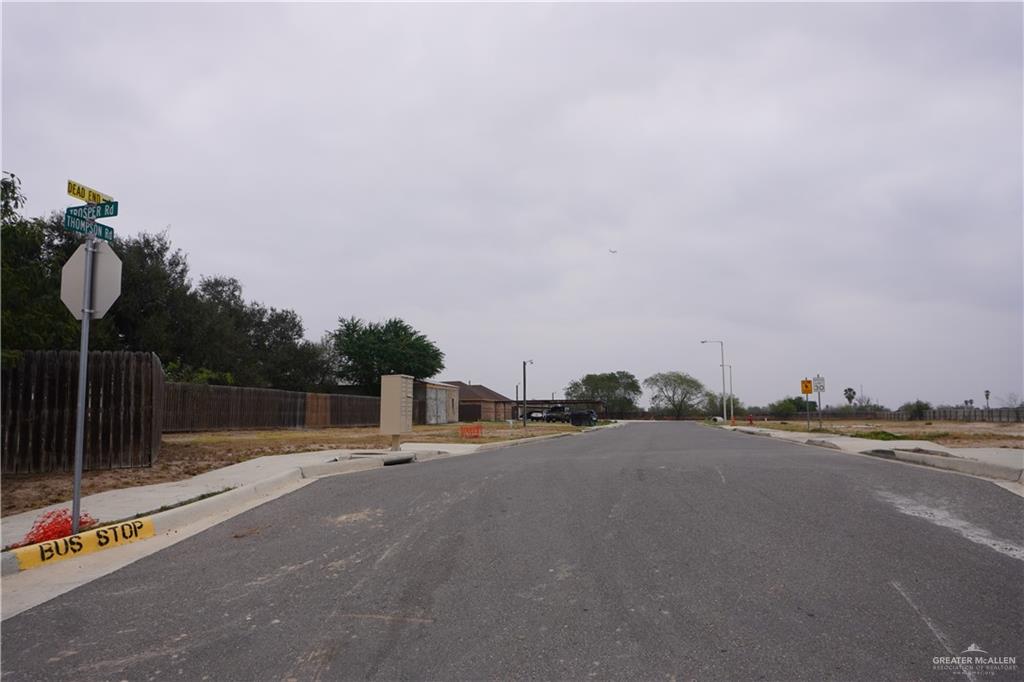 709 Thompson Road Mission, TX 78573 - Photo 3 of 4 a backyard of a house with table and chairs