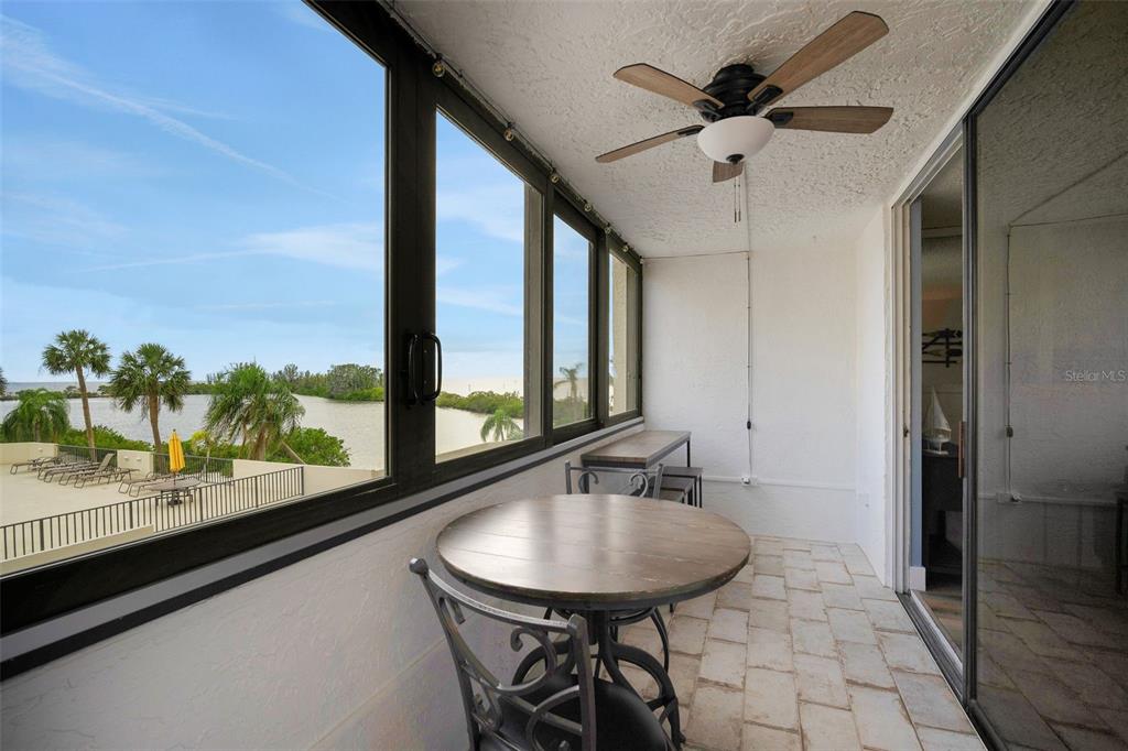 6035 Sea Ranch Drive, Unit 215 Hudson, FL 34667 - Photo 15 of 76 a view of a room with a table and chairs