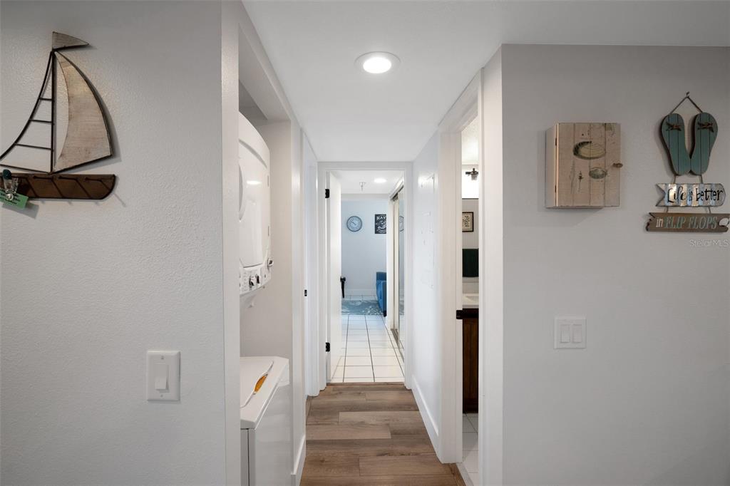6035 Sea Ranch Drive, Unit 215 Hudson, FL 34667 - Photo 21 of 76 a view of a hallway with wooden floor and closet