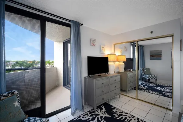 a view of a livingroom with furniture and a flat screen tv