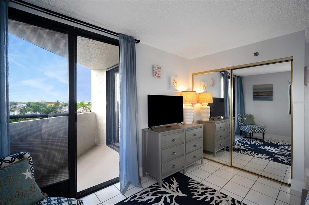 6035 Sea Ranch Drive, Unit 215 Hudson, FL 34667 - Photo 24 of 76 a living room with furniture and a flat screen tv