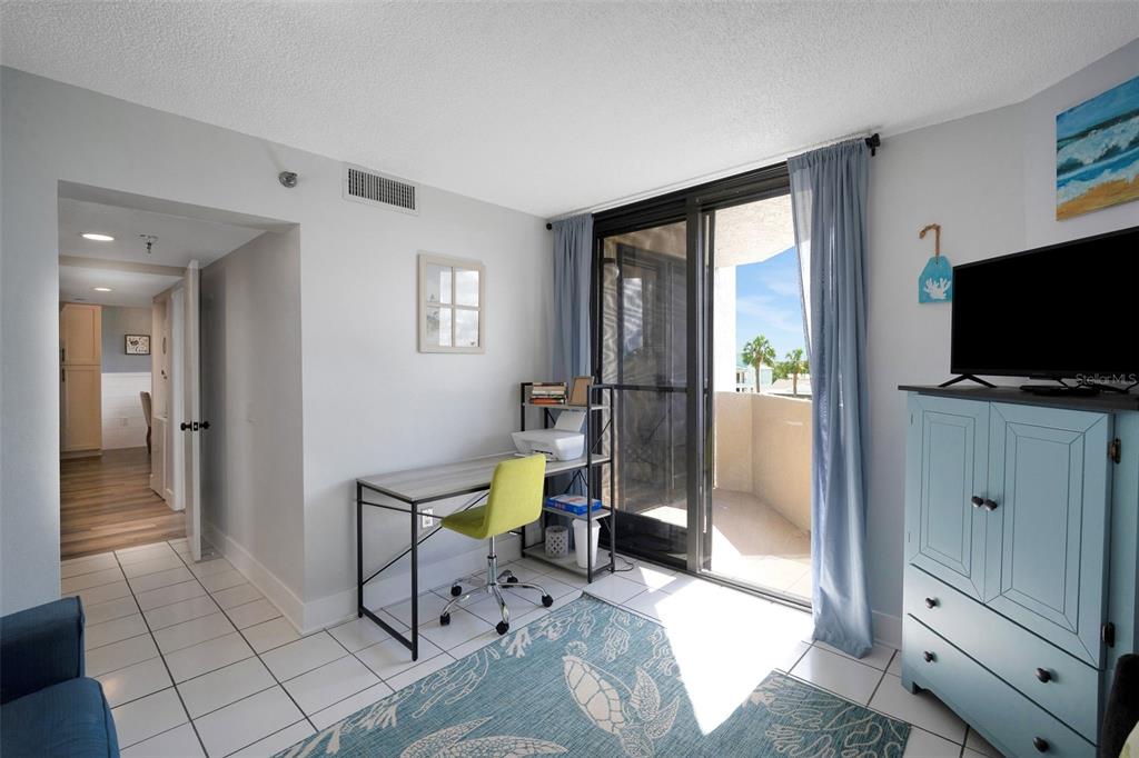 6035 Sea Ranch Drive, Unit 215 Hudson, FL 34667 - Photo 28 of 76 a view of a livingroom with furniture and a flat screen tv