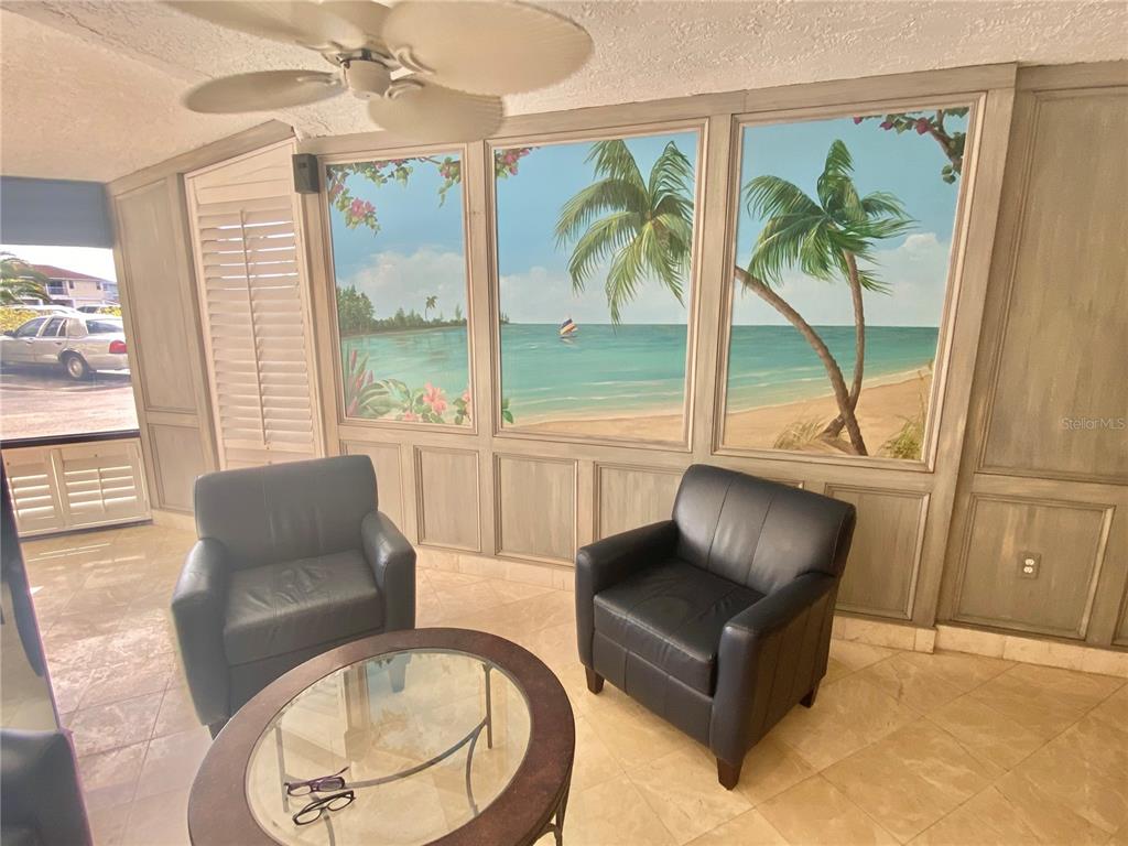 6035 Sea Ranch Drive, Unit 215 Hudson, FL 34667 - Photo 48 of 76 a living room with furniture and a large window