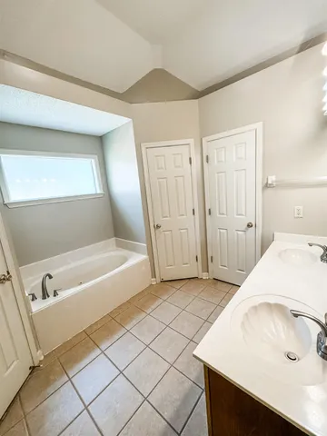 a bathroom with a sink and a bathtub