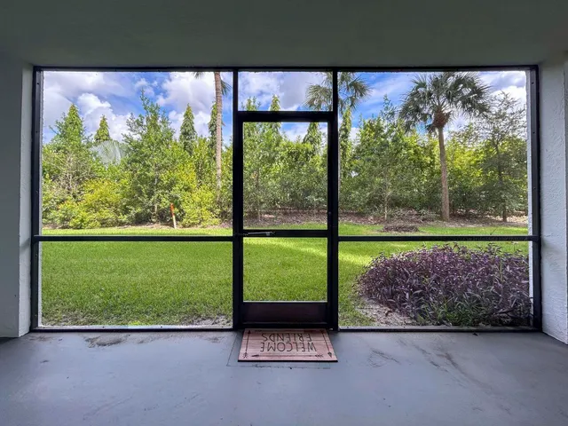 a view of room with a floor to ceiling window and a floor to ceiling window