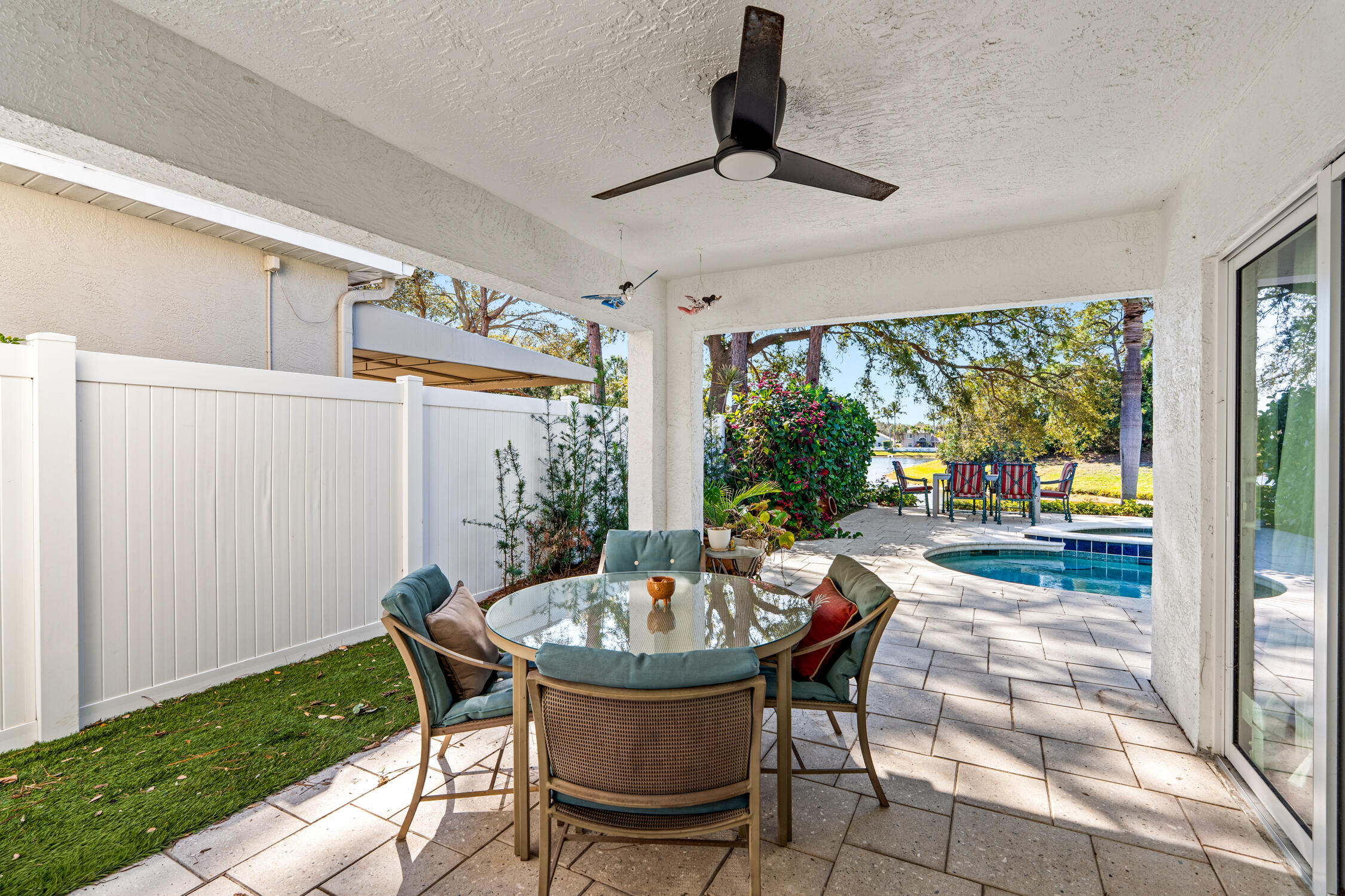 1084 Anchor Point Delray Beach, FL 33444 - Photo 16 of 25 a table and chairs in a patio