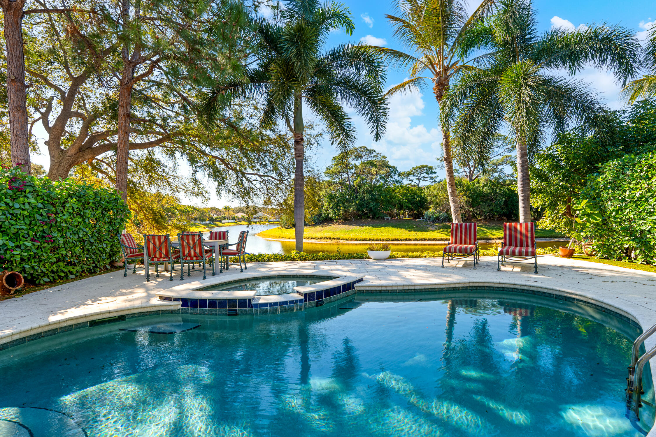 1084 Anchor Point Delray Beach, FL 33444 - Photo 18 of 25 a view of swimming pool with a garden and trees