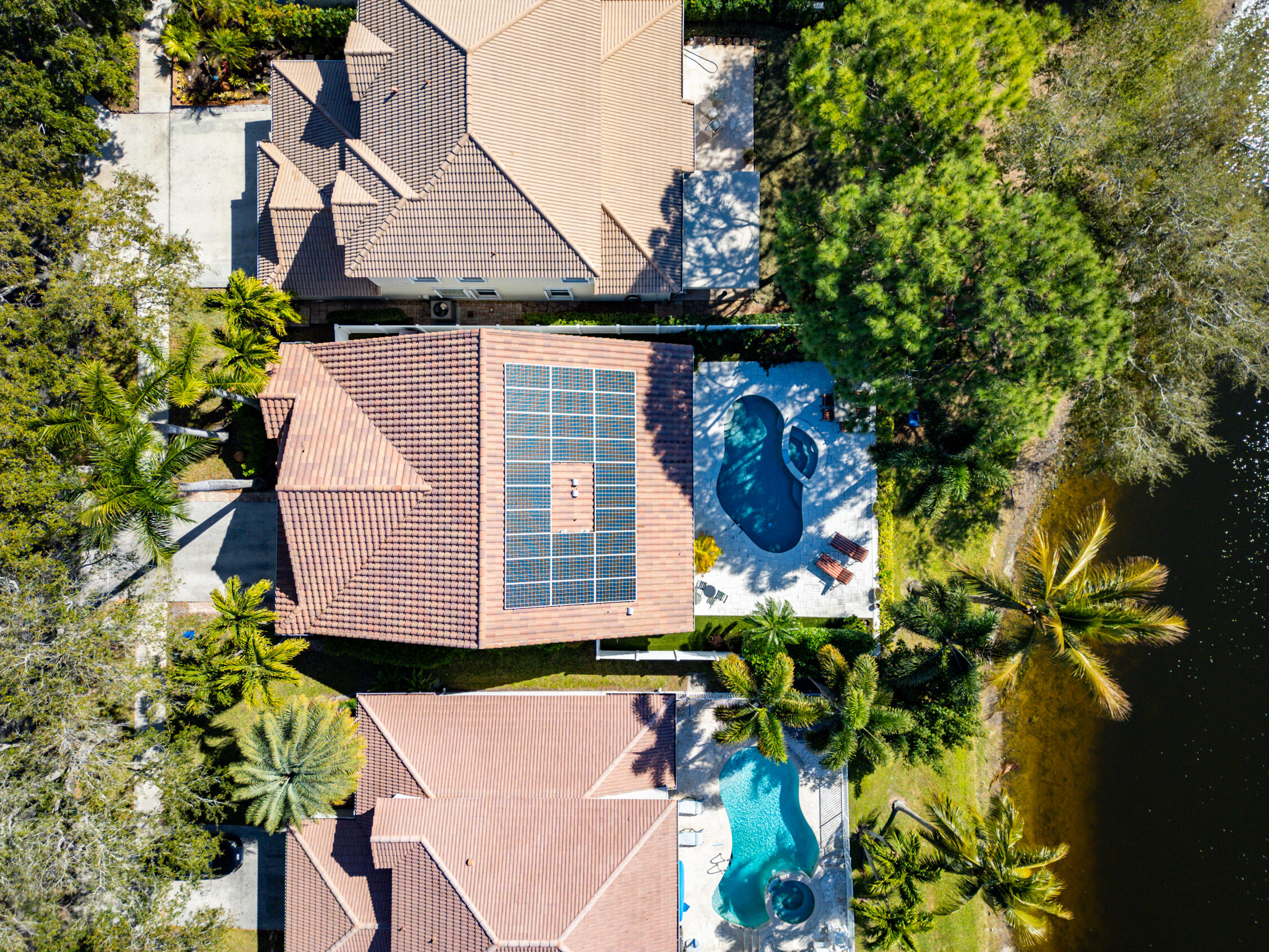 1084 Anchor Point Delray Beach, FL 33444 - Photo 20 of 25 a view of a house with a flower garden