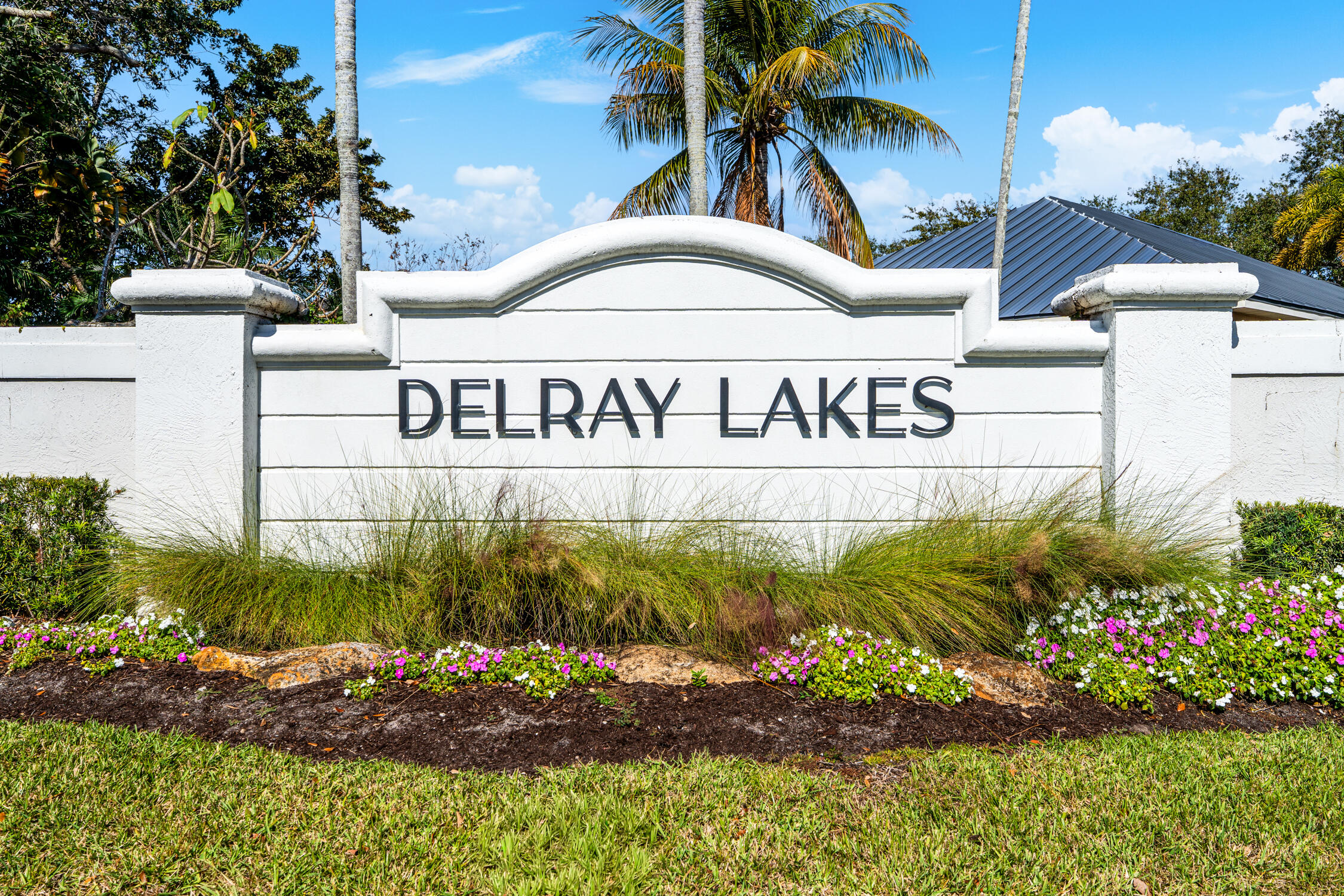 1084 Anchor Point Delray Beach, FL 33444 - Photo 2 of 25 a sign broad in front of flowers