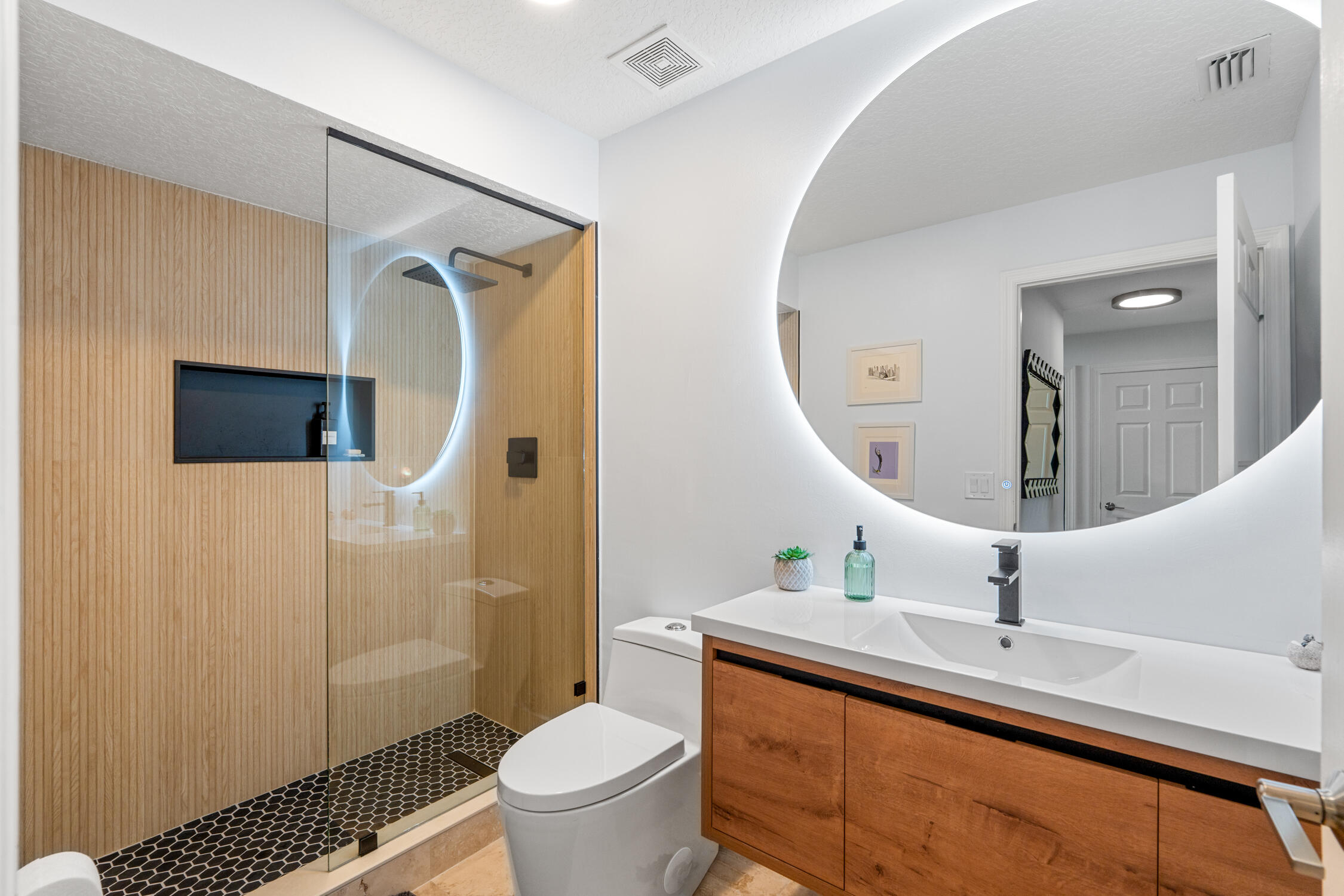 1084 Anchor Point Delray Beach, FL 33444 - Photo 10 of 25 a bathroom with a sink a toilet and shower