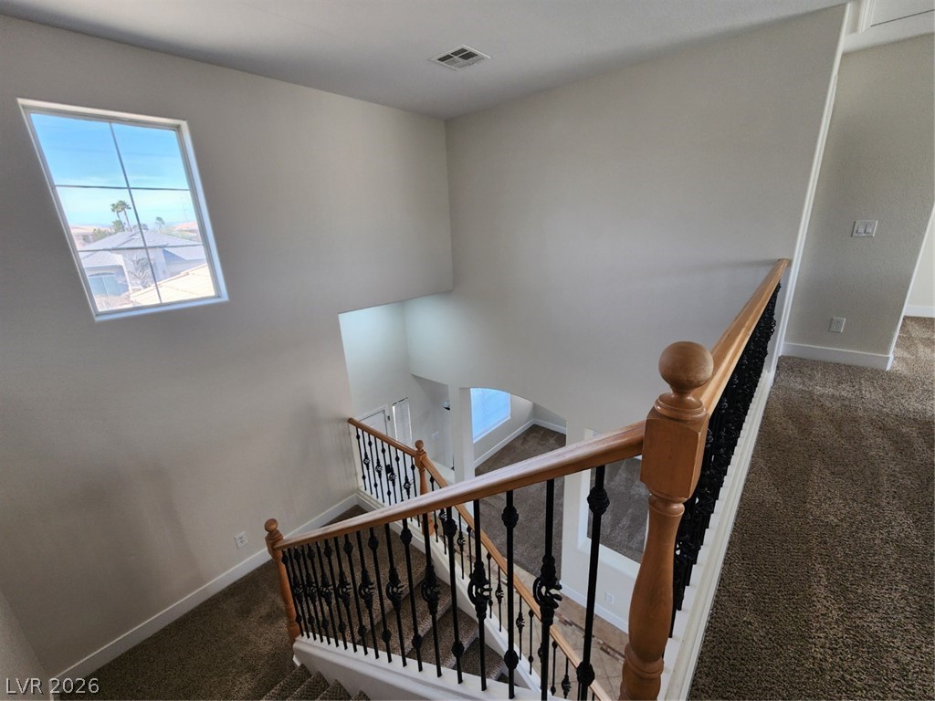 716 Sharon Hills Street Henderson, NV 89052 - Photo 29 of 66 Stairway with carpet and baseboards
