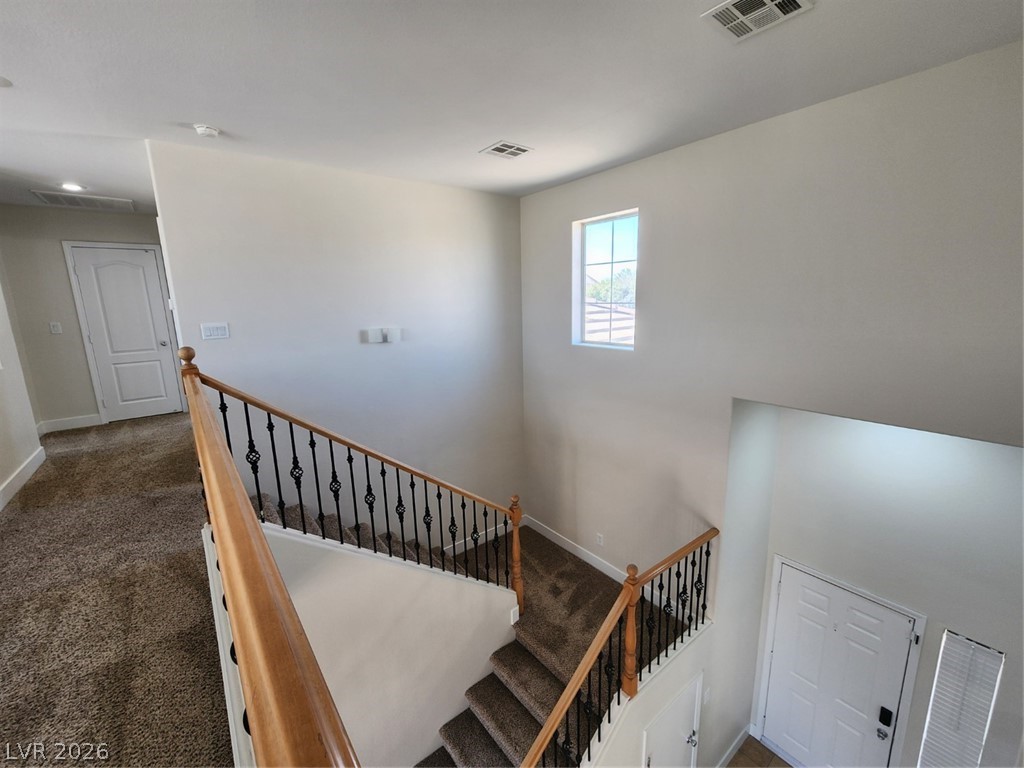 716 Sharon Hills Street Henderson, NV 89052 - Photo 43 of 66 Stairs with carpet floors