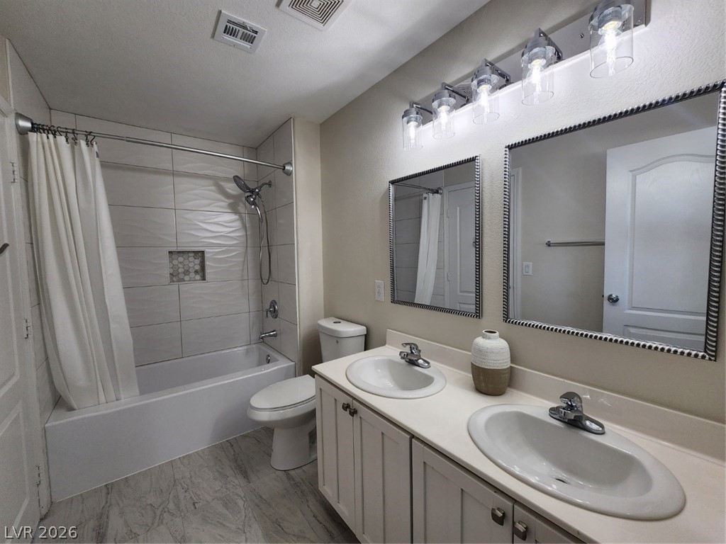 716 Sharon Hills Street Henderson, NV 89052 - Photo 44 of 66 Bathroom featuring shower / bath combo with shower curtain and double vanity