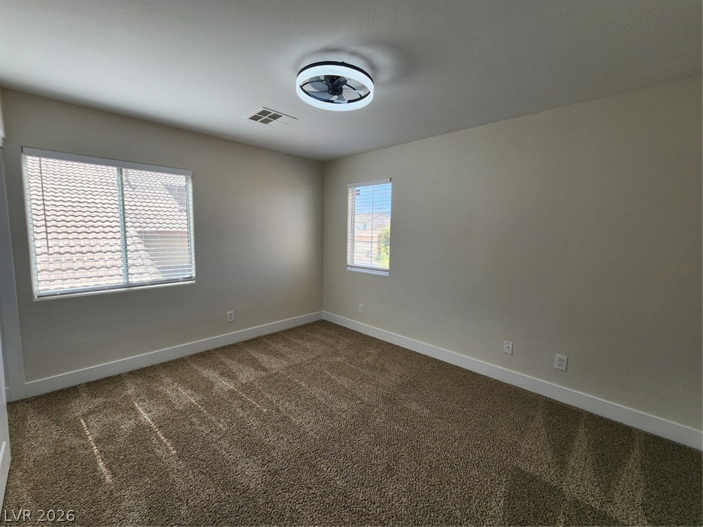 716 Sharon Hills Street Henderson, NV 89052 - Photo 45 of 66 Spare room with dark carpet