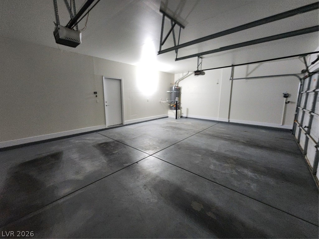 716 Sharon Hills Street Henderson, NV 89052 - Photo 56 of 66 Garage featuring a garage door opener and water heater