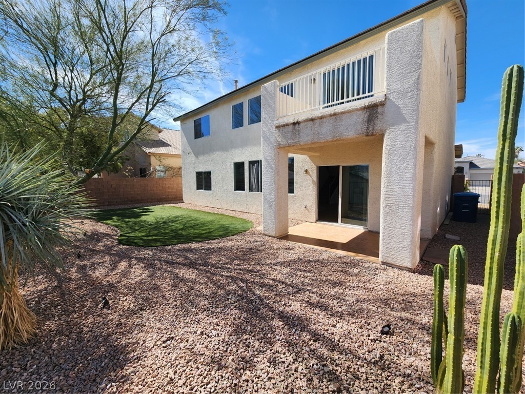 716 Sharon Hills Street Henderson, NV 89052 - Photo 58 of 66 Back of property featuring a patio, stucco siding, and a fenced backyard