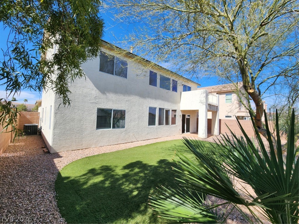 716 Sharon Hills Street Henderson, NV 89052 - Photo 59 of 66 Rear view of house with stucco siding and a fenced backyard