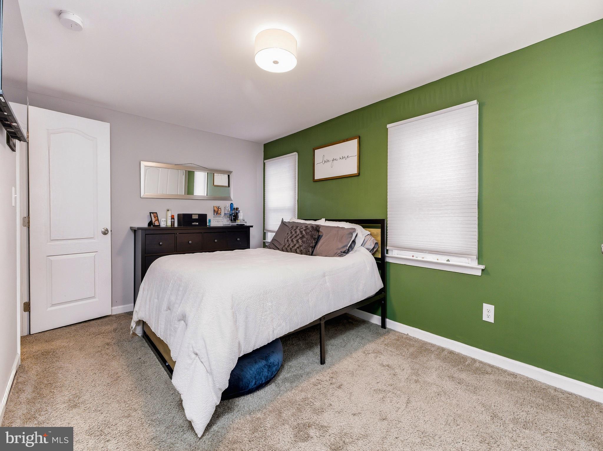 321 West Avenue Pitman, NJ 08071 - Photo 13 of 24 a bedroom with a bed and window