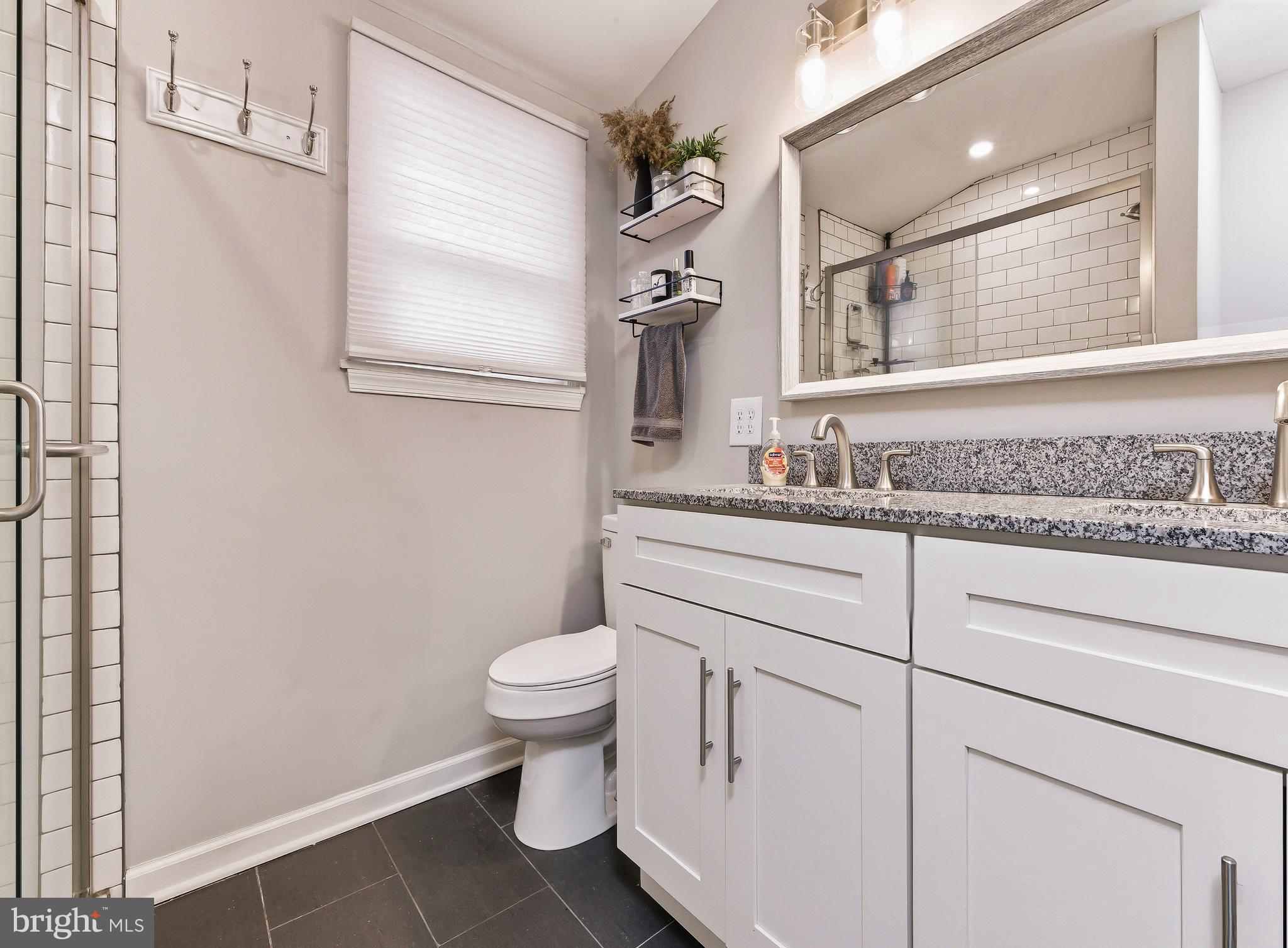 321 West Avenue Pitman, NJ 08071 - Photo 14 of 24 a bathroom with a sink toilet and mirror
