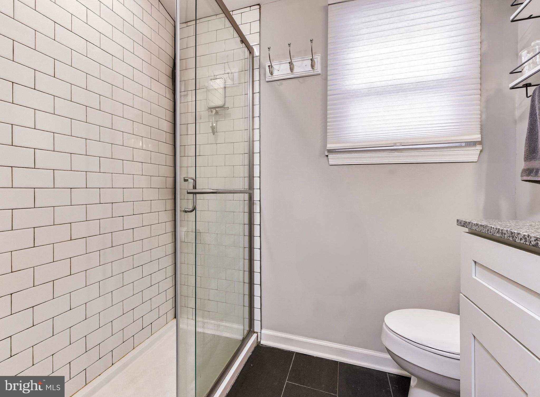 321 West Avenue Pitman, NJ 08071 - Photo 15 of 24 a bathroom with a toilet and a shower