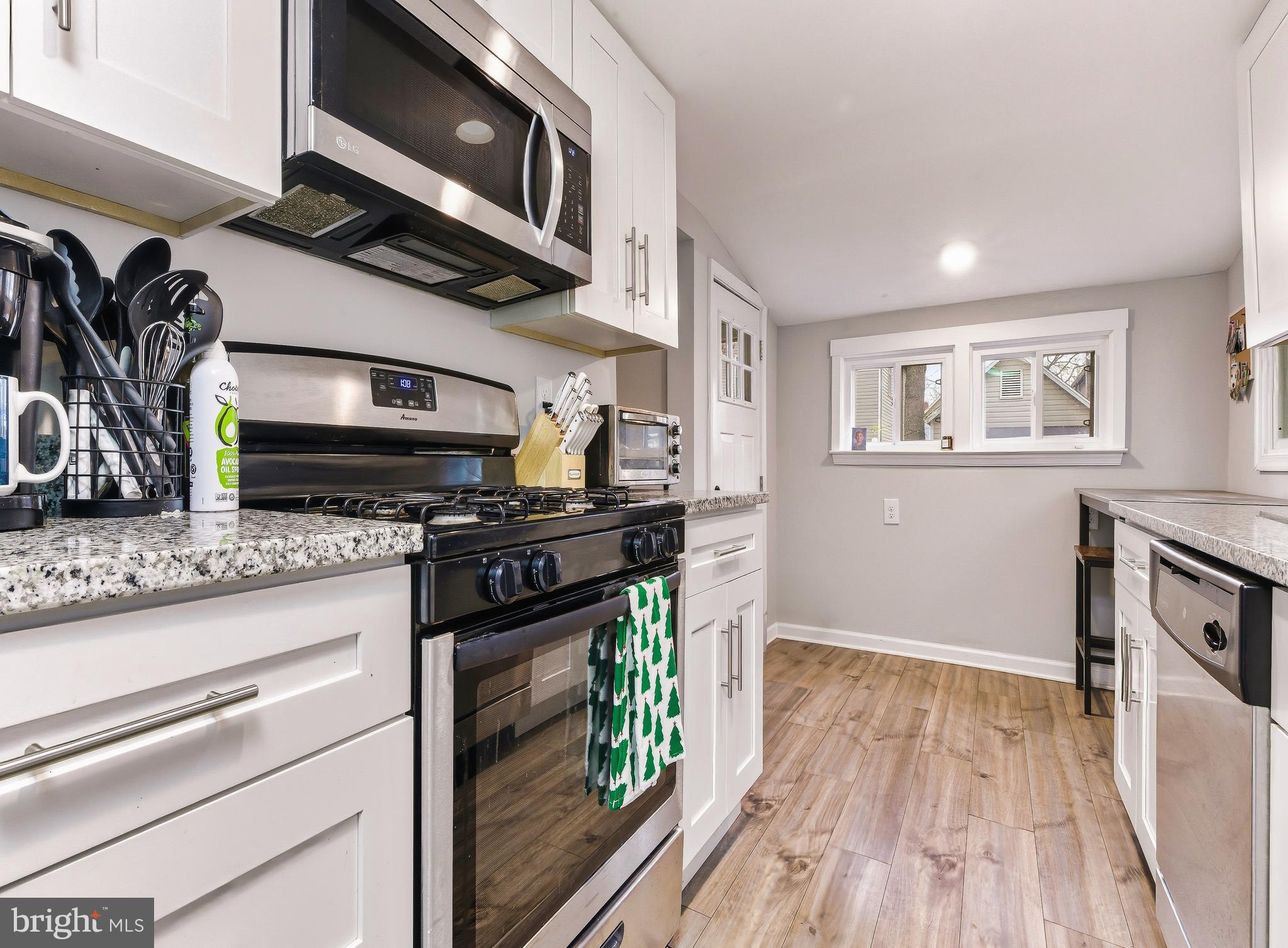 321 West Avenue Pitman, NJ 08071 - Photo 9 of 24 a kitchen with stainless steel appliances granite countertop a stove and a sink