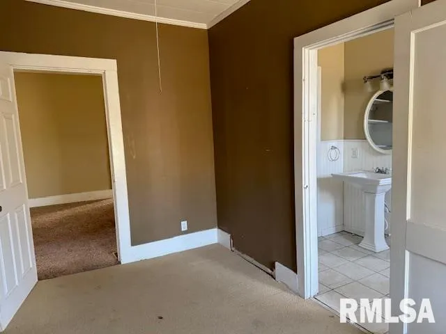a view of a bathroom from a hallway