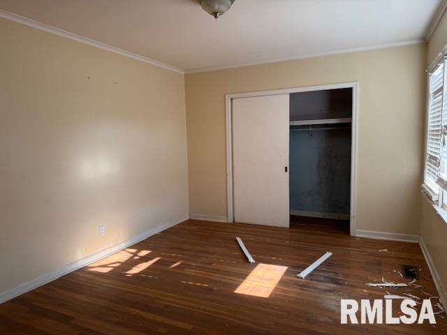 1112 McHaney Road Harrisburg, IL 62946 - Photo 19 of 27 a view of an empty room with wooden floor