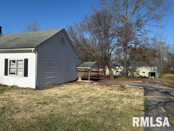 a view of a backyard of the house