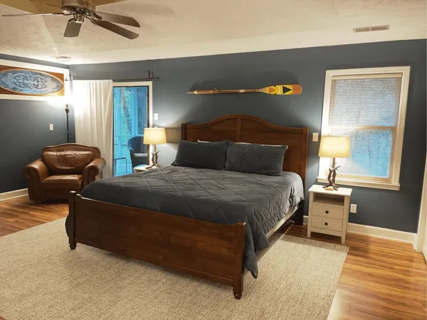 a bedroom with a bed and a fireplace