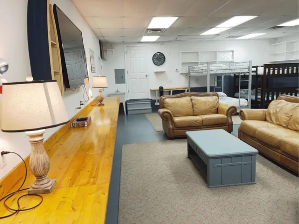 a living room with furniture and a table