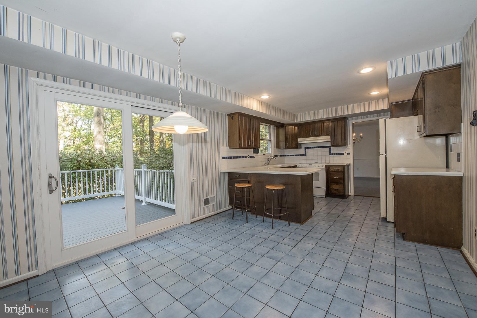 75 Pugh Road Wayne, PA 19087 - Photo 8 of 26 Eat-in Kitchen leading to deck