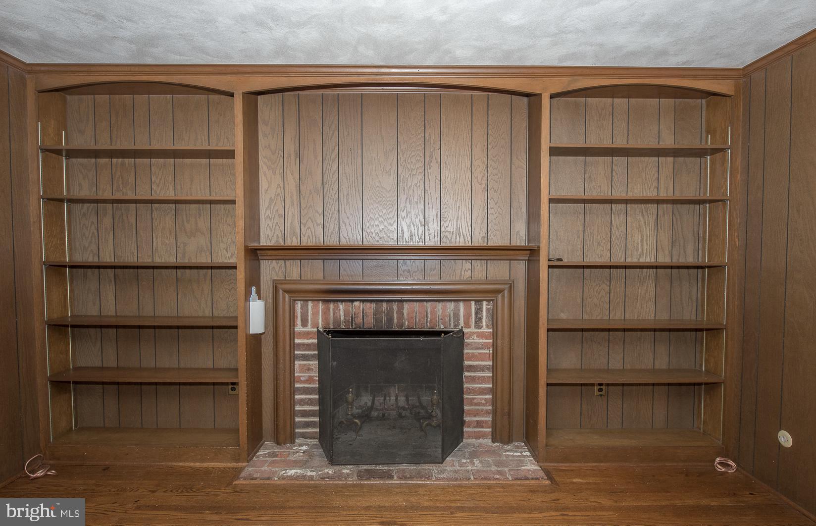 75 Pugh Road Wayne, PA 19087 - Photo 9 of 26 Den with wood burning fireplace