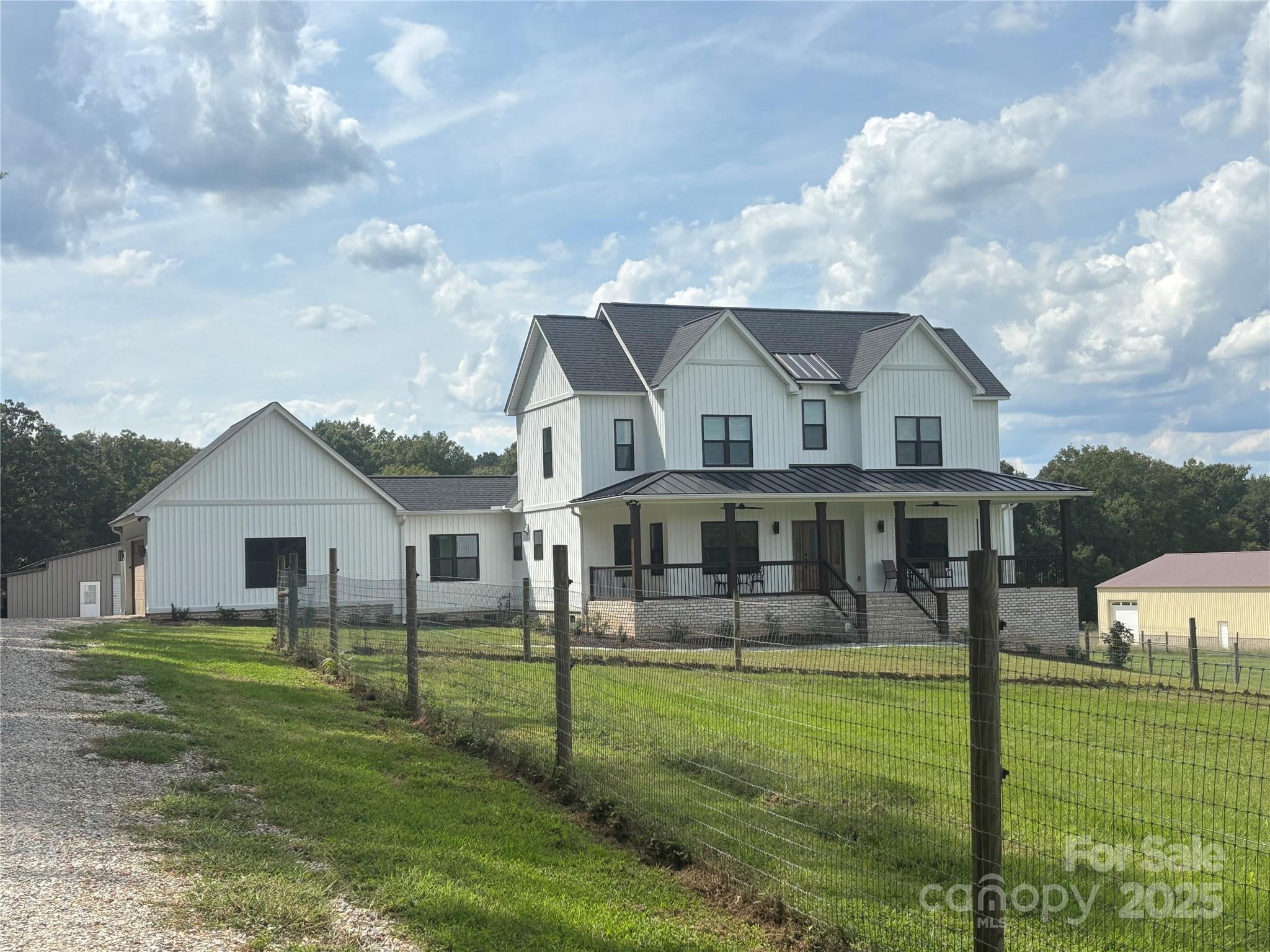 4802 Wolf Pond Road Monroe, NC 28112 - Photo 1 of 1 a front view of a house with garden