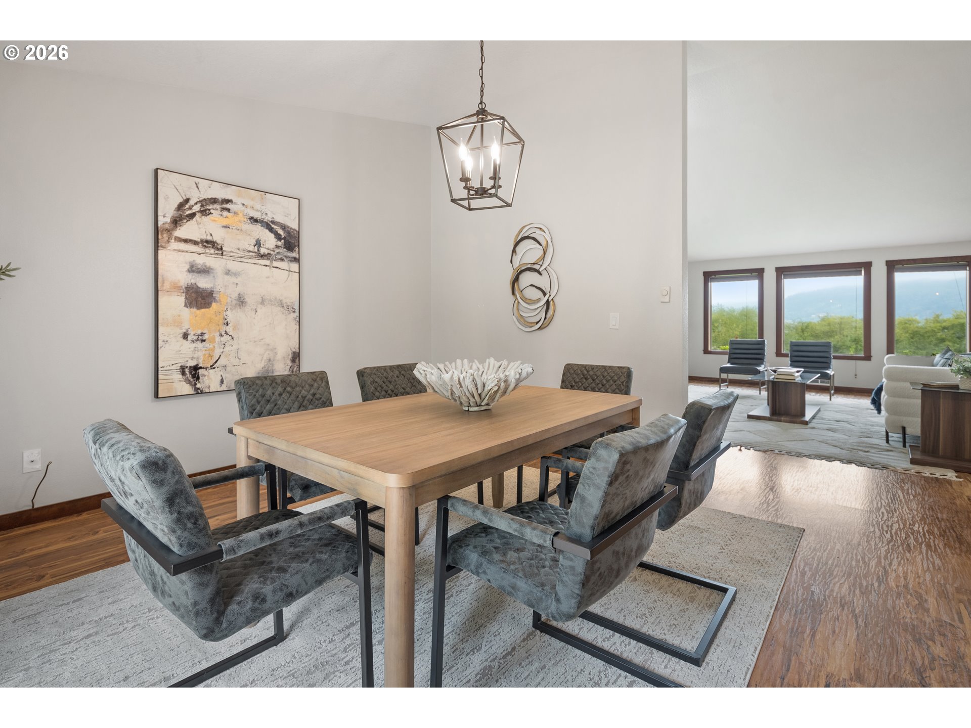 650 Marvin Road Tillamook, OR 97141 - Photo 15 of 48 a view of a dining room with furniture wooden floor and a chandelier
