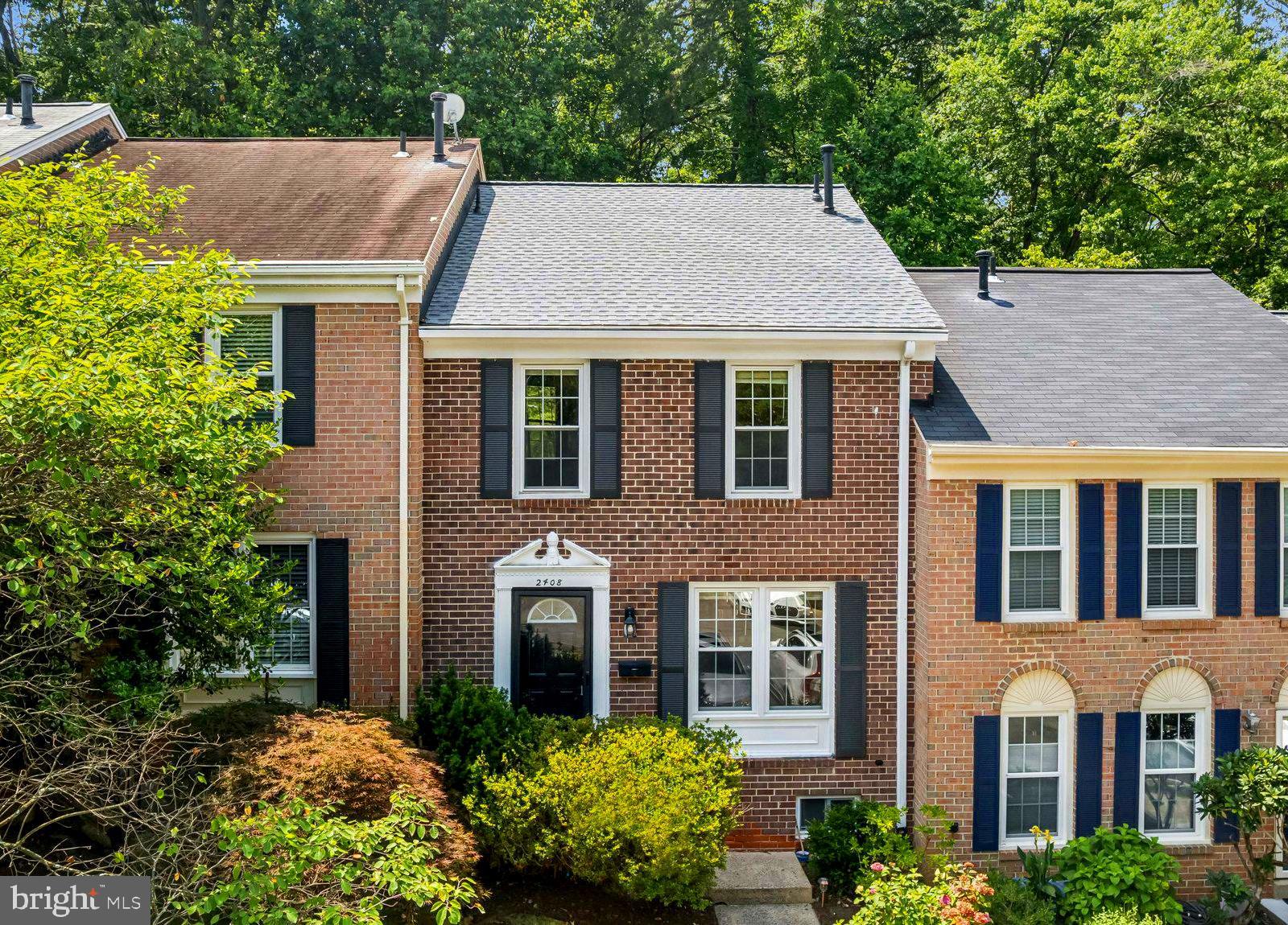 2408 Wanda Way Reston, VA 20191 - Photo 1 of 45 front view of a house with a yard