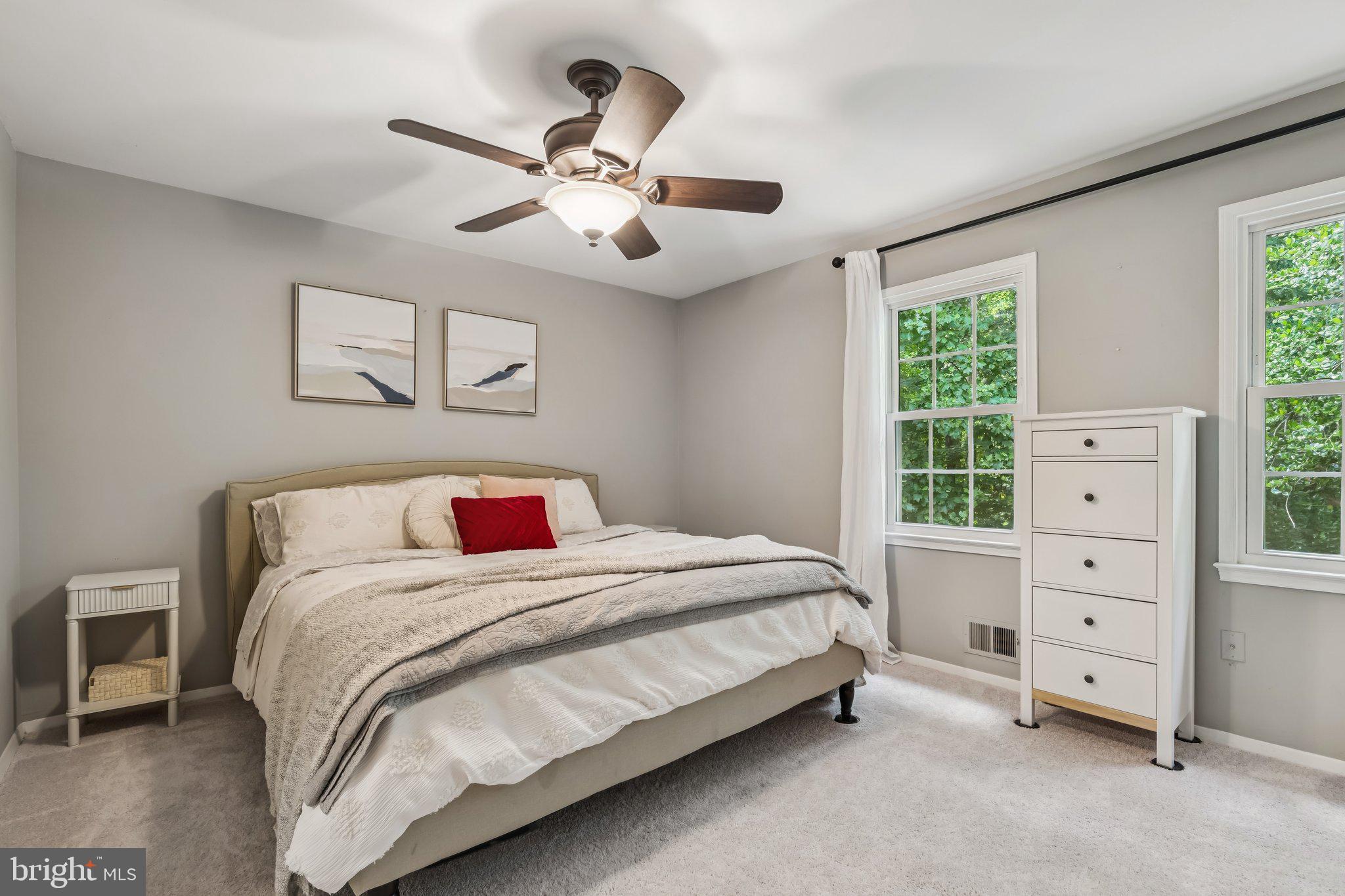 2408 Wanda Way Reston, VA 20191 - Photo 12 of 45 a bedroom with a bed and a dresser