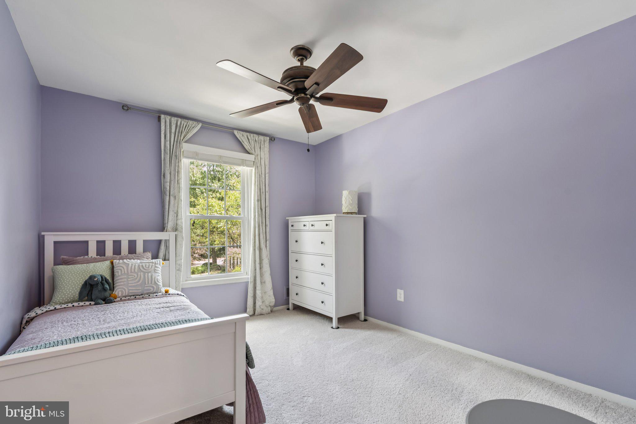 2408 Wanda Way Reston, VA 20191 - Photo 17 of 45 a bedroom with a bed and a chandelier