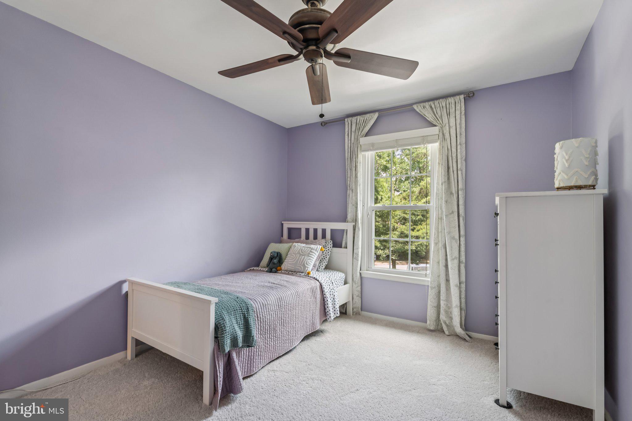2408 Wanda Way Reston, VA 20191 - Photo 18 of 45 a bedroom with a bed and a chandelier