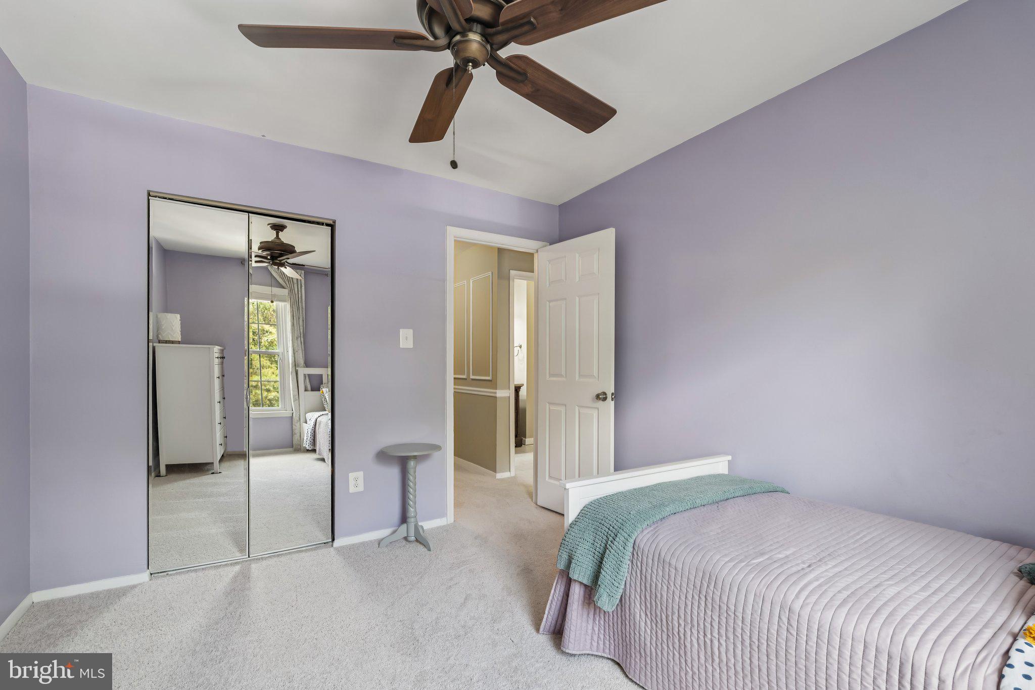 2408 Wanda Way Reston, VA 20191 - Photo 19 of 45 a bedroom with a bed and a chandelier