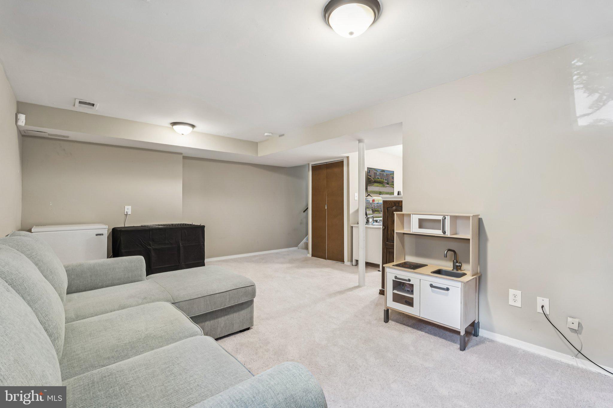 2408 Wanda Way Reston, VA 20191 - Photo 24 of 45 a living room with furniture