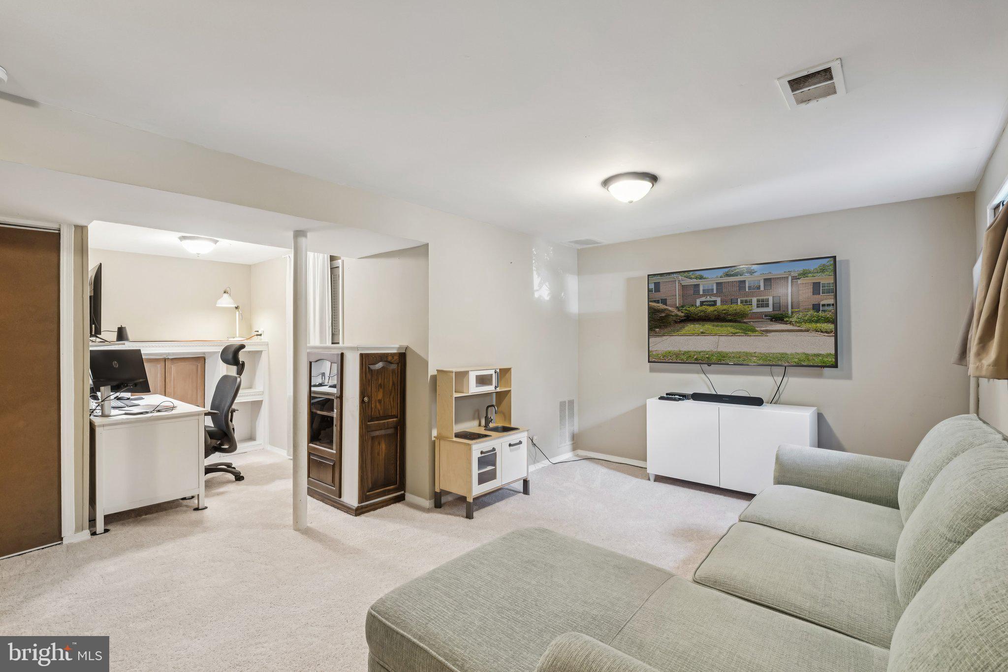 2408 Wanda Way Reston, VA 20191 - Photo 25 of 45 a living room with furniture and view of kitchen