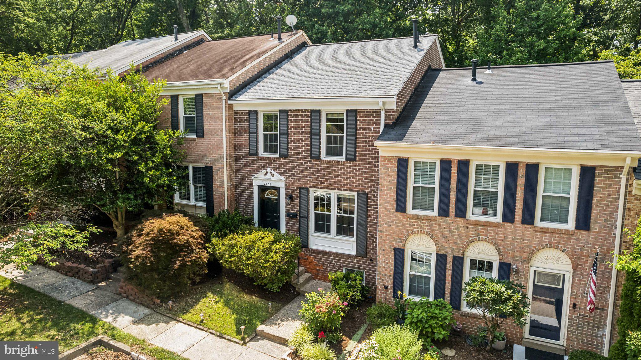 2408 Wanda Way Reston, VA 20191 - Photo 32 of 45 a aerial view of a house with a yard and potted plants