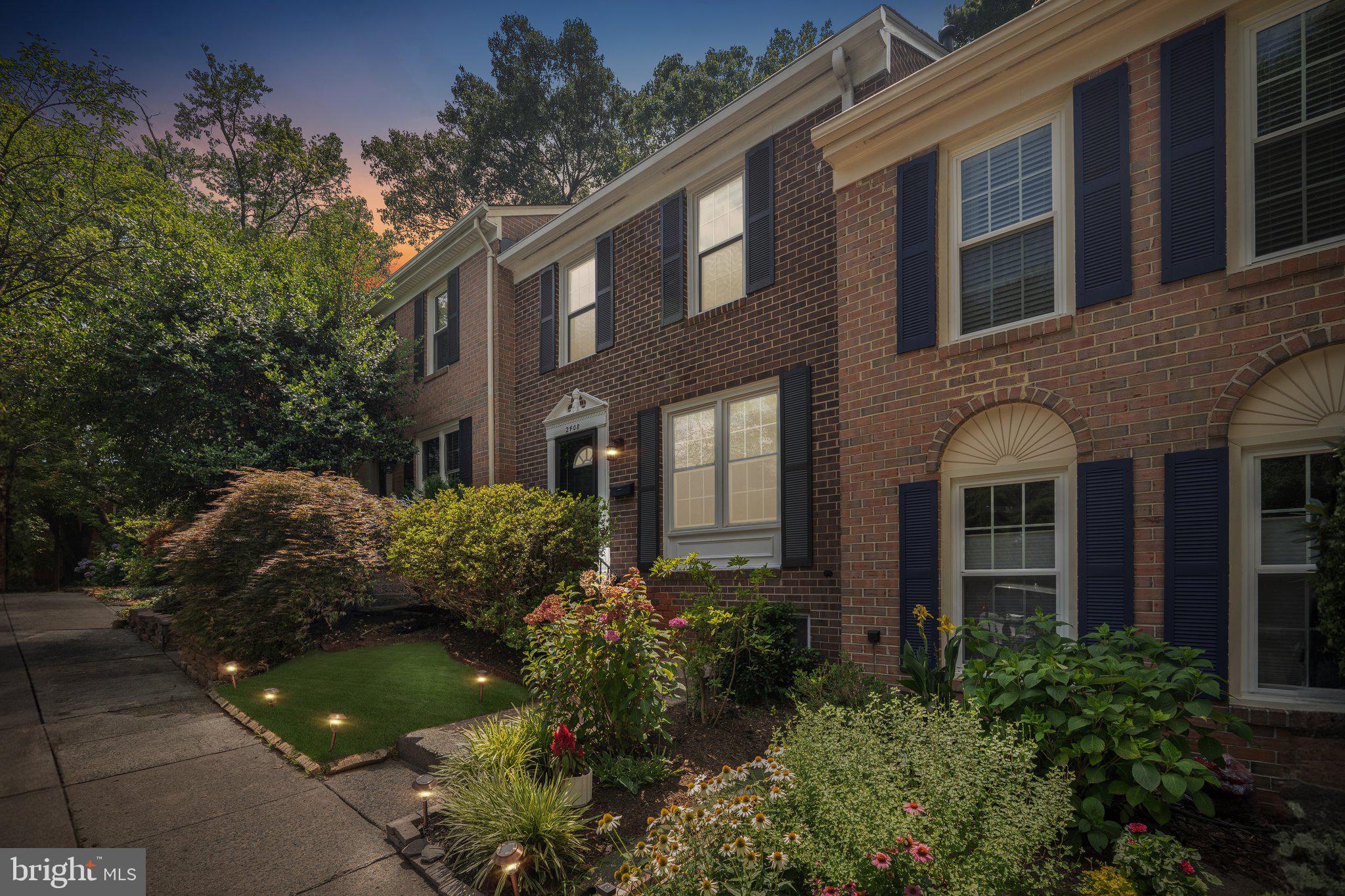 2408 Wanda Way Reston, VA 20191 - Photo 33 of 45 a view of a brick building next to a yard