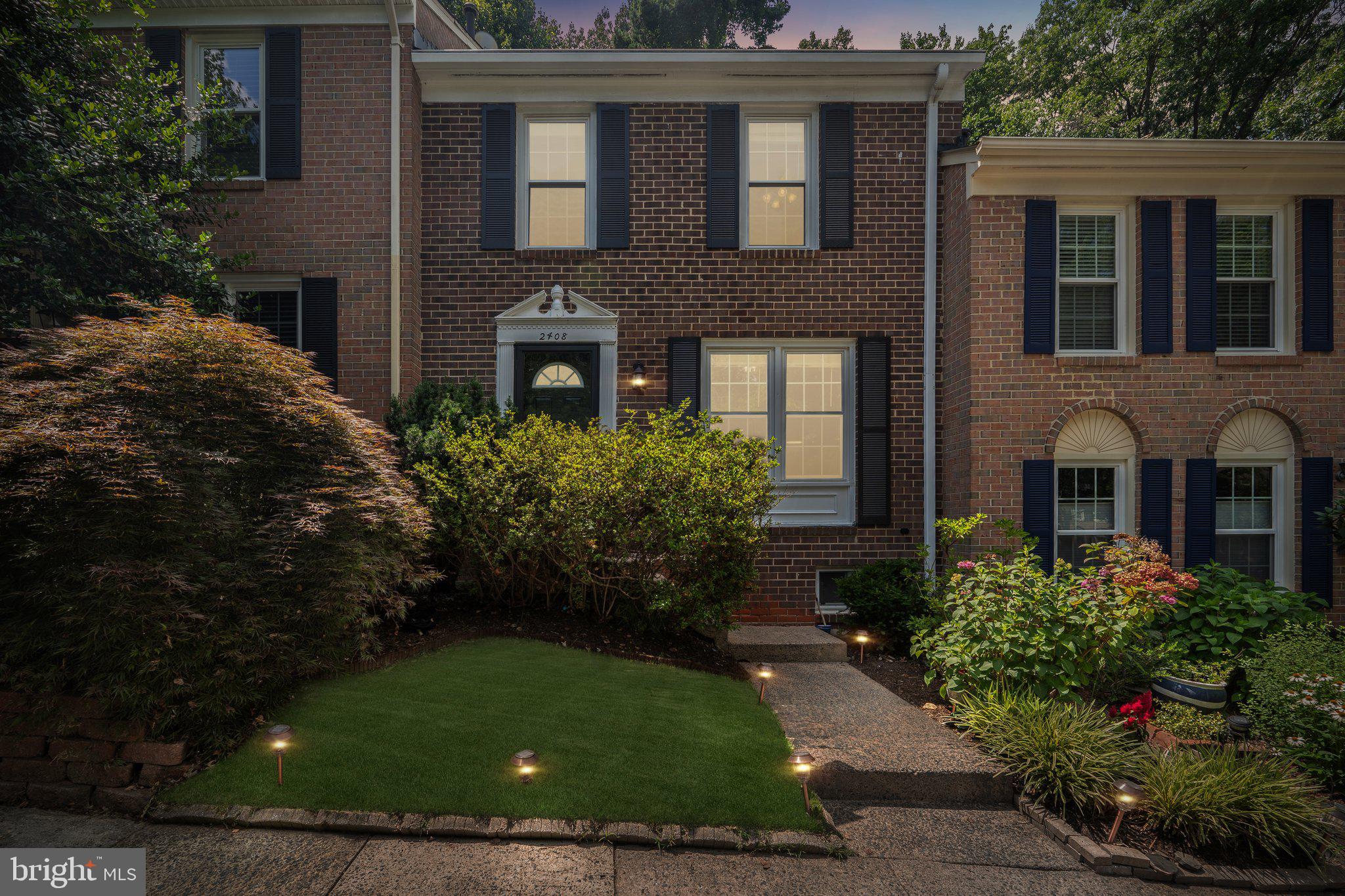 2408 Wanda Way Reston, VA 20191 - Photo 34 of 45 a front view of a house with garden