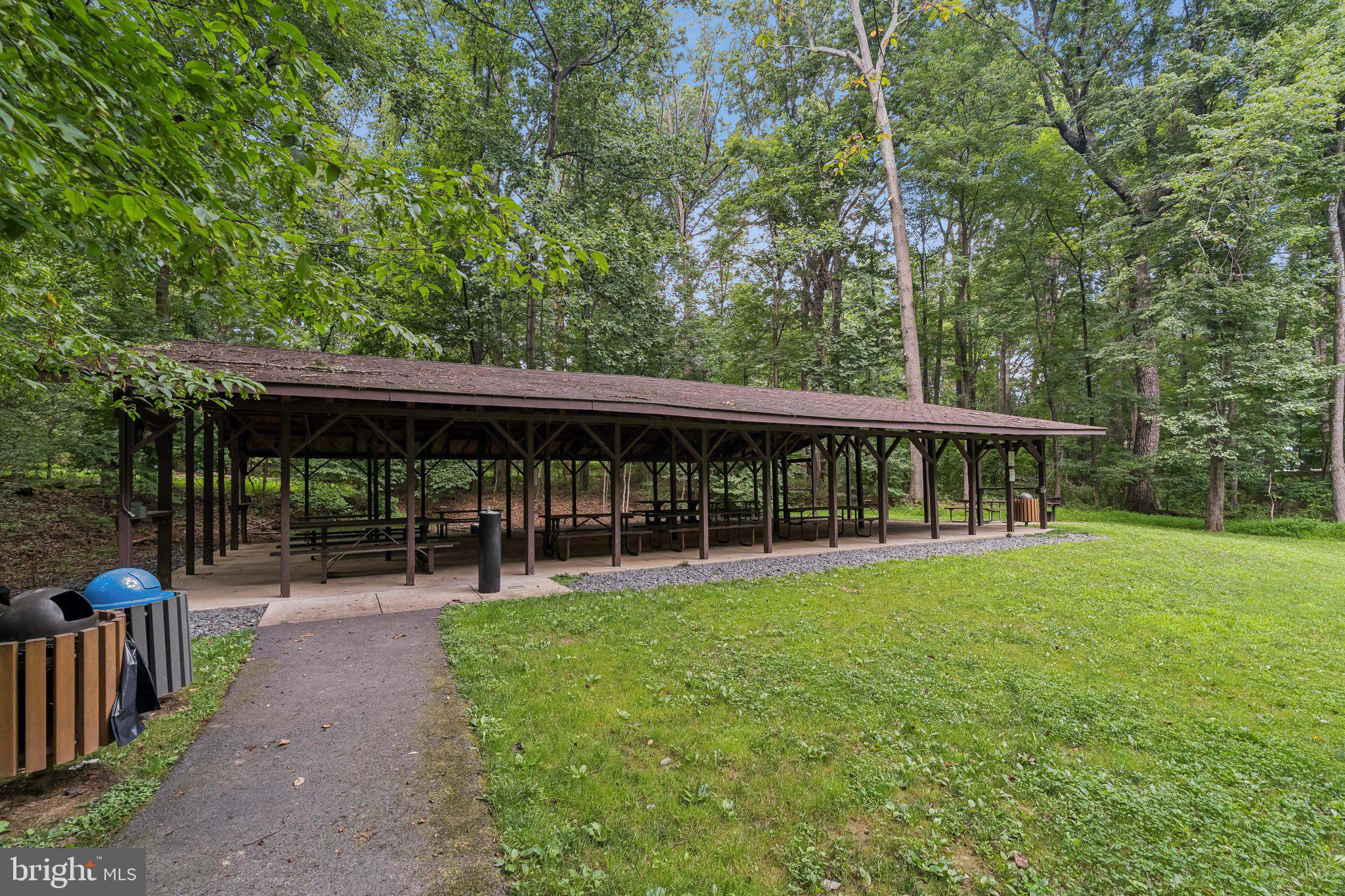 2408 Wanda Way Reston, VA 20191 - Photo 38 of 45 a view of a sitting area with large trees and plants