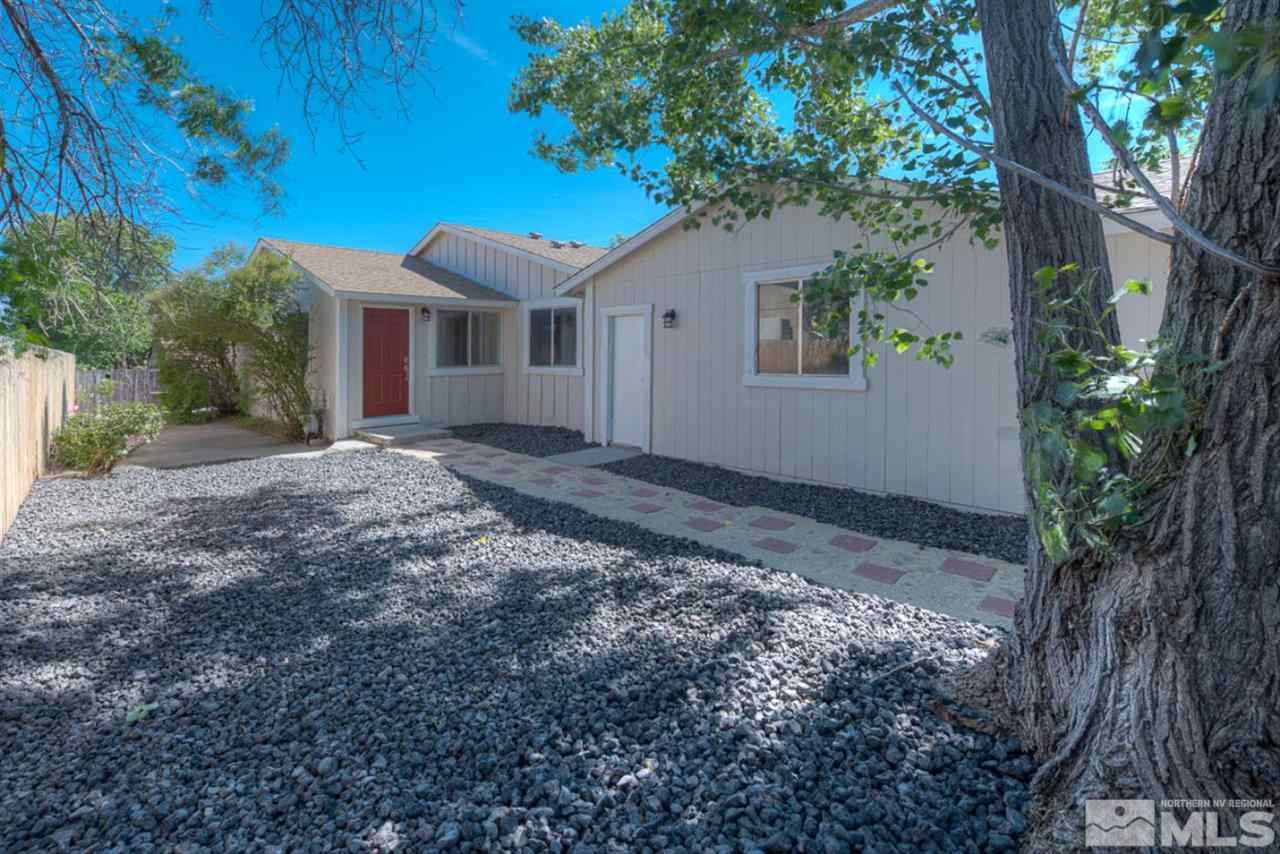 6815 Flower Street Reno, NV 89506 - Photo 25 of 25 a front view of a house with a yard