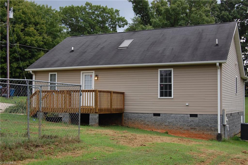 4301 Edgemore Road Greensboro, NC 27455 - Photo 4 of 19 Rear exterior. Dog kennel can be removed