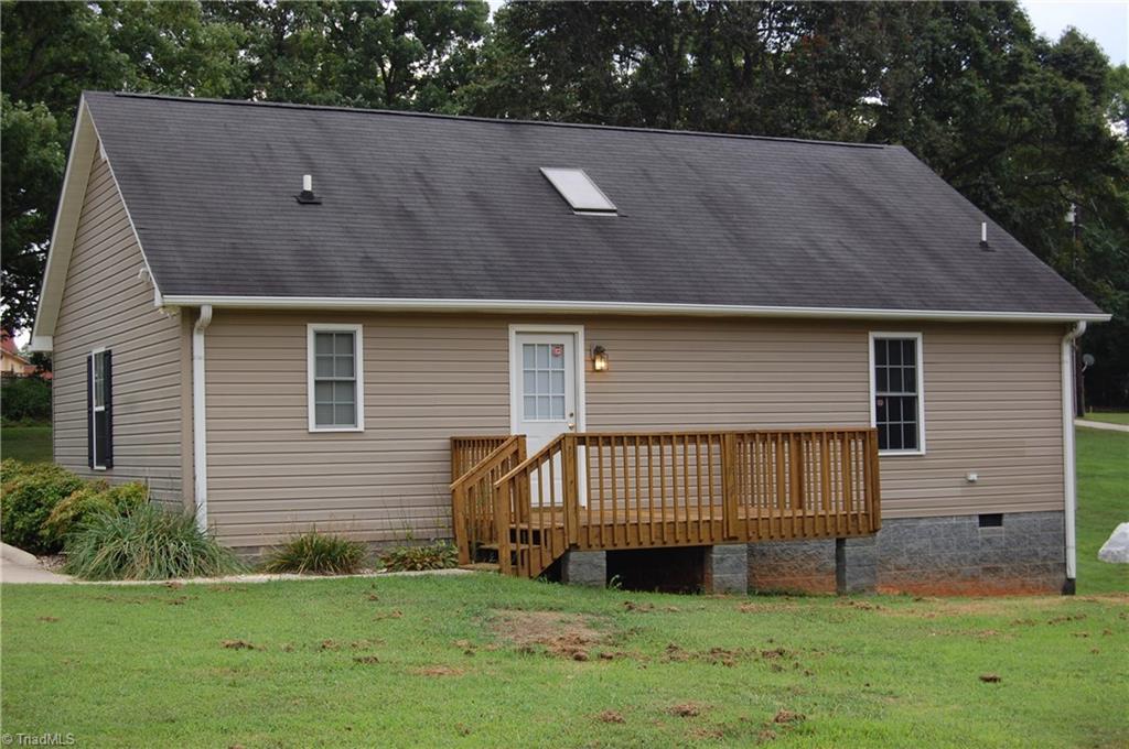 4301 Edgemore Road Greensboro, NC 27455 - Photo 5 of 19 Double paved driveway with concrete walkways to front entrance and rear deck.