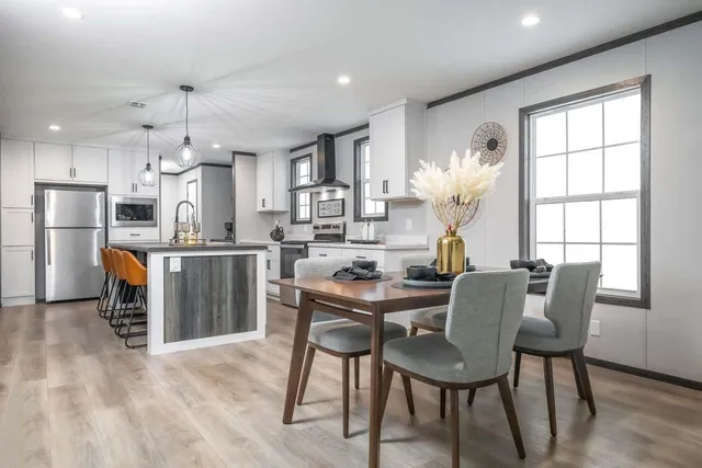 a view of a dining room with furniture and a chandelier