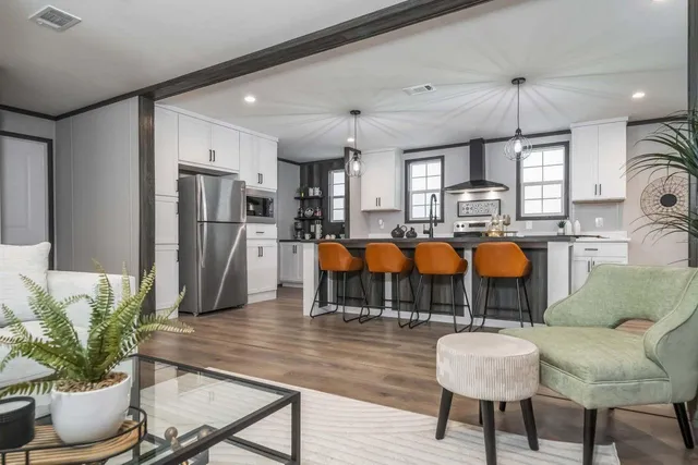 a dining room with furniture and chandelier